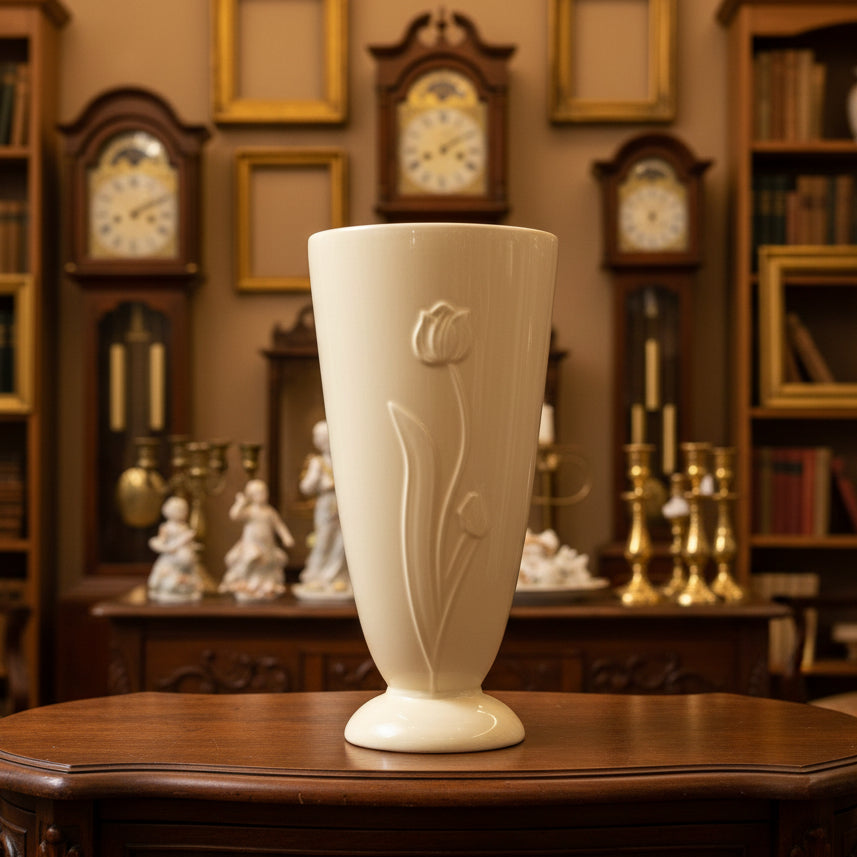 Beige ceramic vase on a green fabric-covered table
